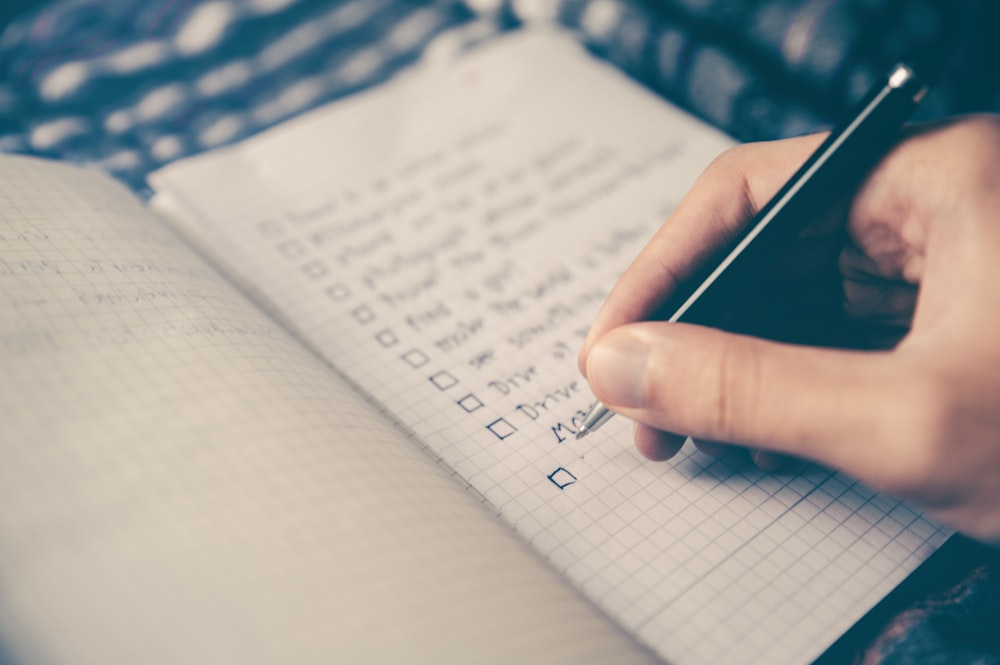 Checklist and planning notebook on a desk